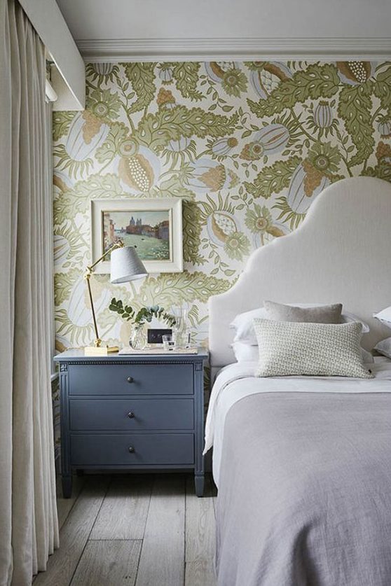a neutral bedroom spruced up with pastel and muted color botanical wallpaper with abstract prints