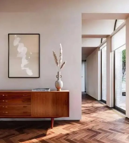a cool mid-century modern sideboard with doors and drawers, on small and sturdy legs is a lovely idea for your space