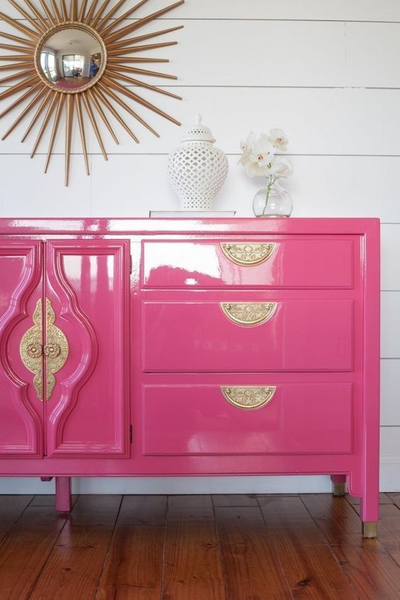 a fantastic pink lacquer credenza with gold touches and pattern is a cool and catchy color statement to rock