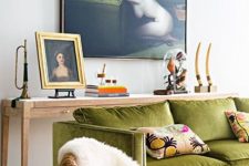 27 a refined eclectic living room with a long console table, a chartreuse sofa with pillows, a chair and some art