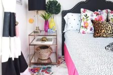 28 a glam and bold bedroom with a black and pink bed, polka dot, leopard and floral prints, polka dots on the wall and striped curtains