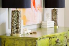 29 a super glam chartreuse console table with a brushed finish and leopard table lamps is wow