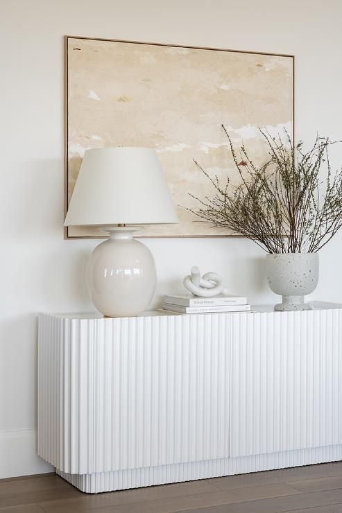 a white fluted credenza will be a perfect fit for many spaces, from living rooms to entryways