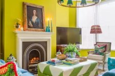 34 a colorful and eclectic living room with chartreuse walls, a fireplace, a bold printed ottoman, navy chairs and a sofa, a catchy chandelier