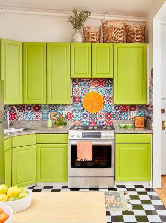 a bold chartreuse kitchen with a colorful tile backsplash and a neutral countertop, a checked tile floor and baskets on top