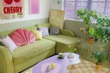a bright living room with lilac shades, a chartreuse sofa, a lilac table, some checked pieces and pillows