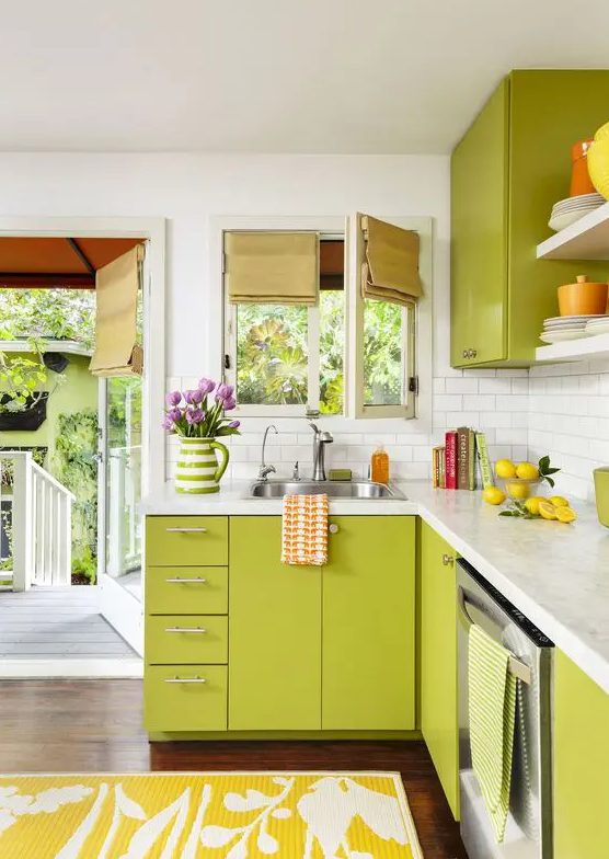 a chartreuse kitchen with a white subway tile backsplash and white countertops and bold shades and linens