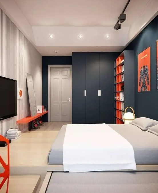a clean minimalist or contemporary teenage bedroom with charcoal walls, a striped one, a platform bed, bright red touches