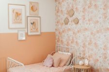 a cute girl’s room with a floral wallpaper