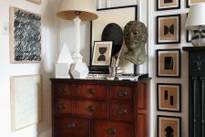 a dark-stained credenza with some decor and a gallery wall will add chic to any space