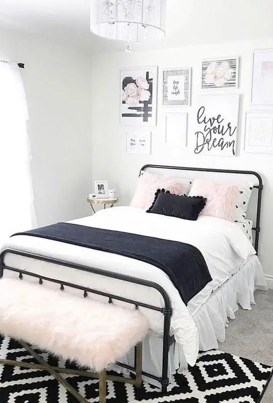 a lovely teen bedroom with a black metal bed, contrasting bedding, a pretty gallery wall and a pink faux fur bench