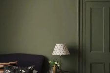 a green bedroom with a stucco ceiling