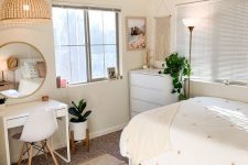a neutral modern to Scandi teen room with white furniture from IKEA, neutral textiles, potted greenery and a round mirror