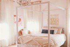 a neutral teen bedroom with a neutral bed and bedding, a stained bench with peachy faux fur and a floral chandelier