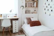 a serene Scandinavian teen bedroom with shelves, a desk, a bed, neutral textiles, a gallery wall with string lights and a fluffy lamp