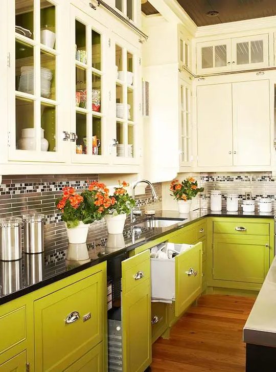 an eye-catchy creamy and chartreuse kitchen with a skinny tile backsplash and a black countertop is a cool and creative idea