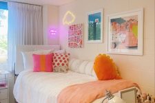 an eye-catchy teen room with a bed, a bold gallery wall with neon, a vanity and some more simple furniture