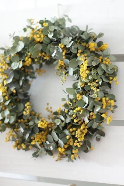 a beautiful and timeless spring wreath of greenery and mimosa is a lovely spring decoration to rock