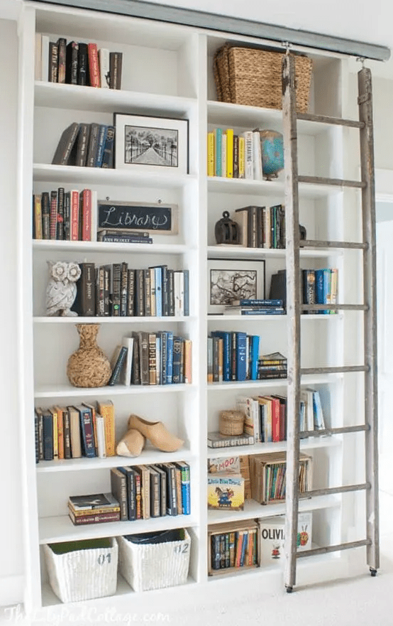 A custom IKEA bookshelf built in, with a ladder and some basket for storage is a very nice option to rock