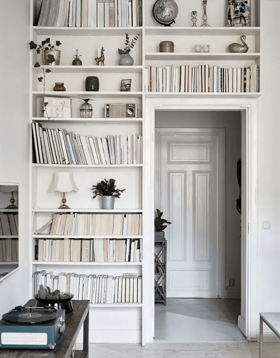 a doorway with built-in bookshelves, with books and other stuff is a lovely idea for any home, use this dead space