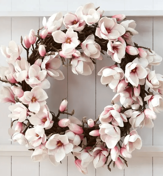 a faux cherry blossom wreath is a stylish and cool idea for spring, it will make your front door look romantic