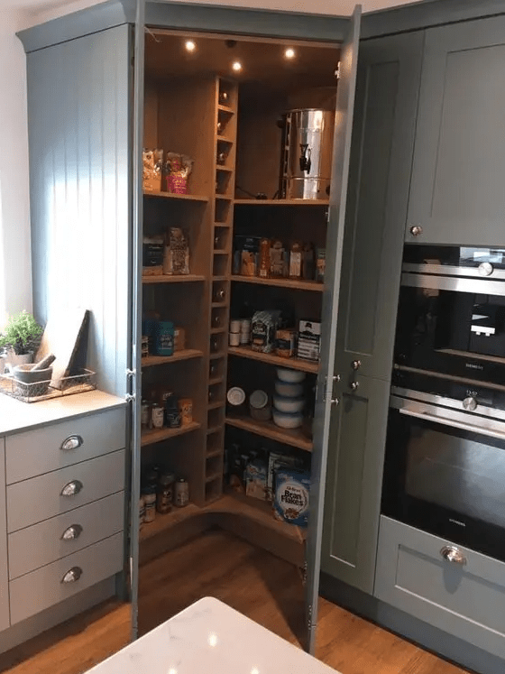 a small rustic pantry with built-in shelves and wine bottle storage, lights and food, drinks and other stuff