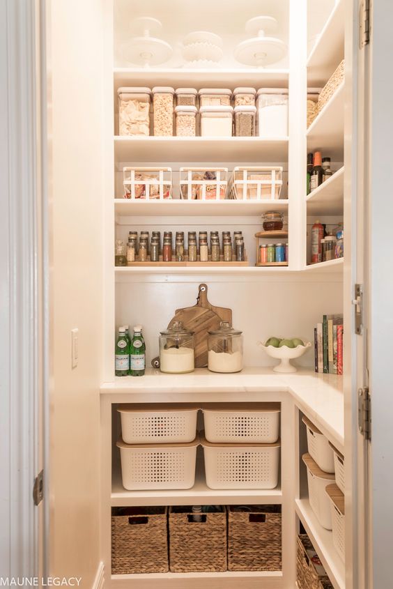 a small well organized pantry with lights, open shelves, cubbies and baskets is a cool space for storage