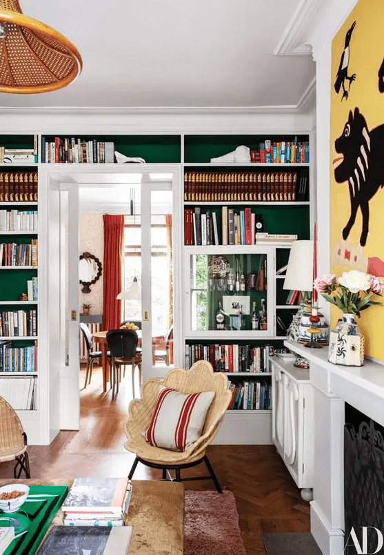 Built in bookshelves over the doorway are a nice way to decorate and use the wall and are amazing