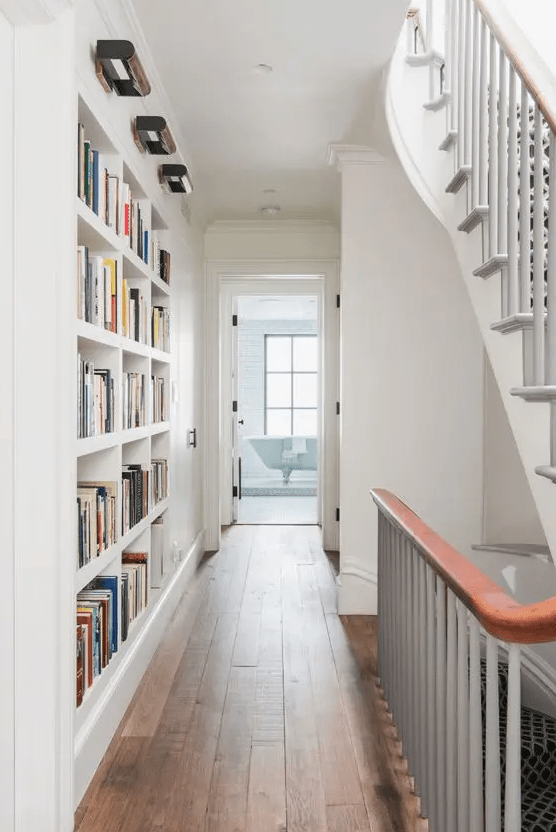 make some built-in bookshelves in your passway or corridor to use this wall and save a lot of space