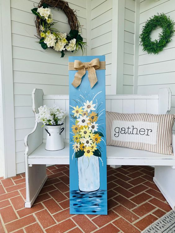 a beautiful and colorful spring sign with painted blooms in a churn is a fantastic idea if you like painting