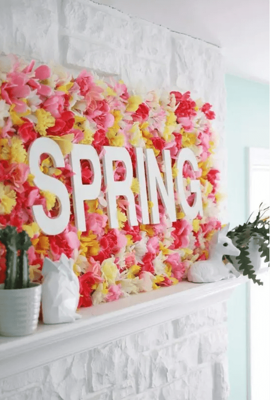 a creative spring sign made of bright faux blooms and some letters is a fantastic idea for your mantel