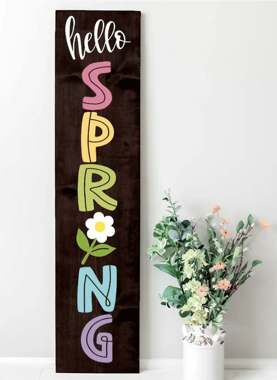 a dark stained wooden plaque sign with colorful letters and a bloom is a simple and cool idea for spring