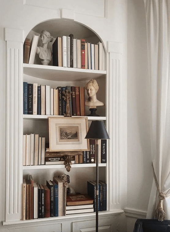 a refined arched bookcase with books and amazing chic decor is a lovely idea for many space, it looks awesome