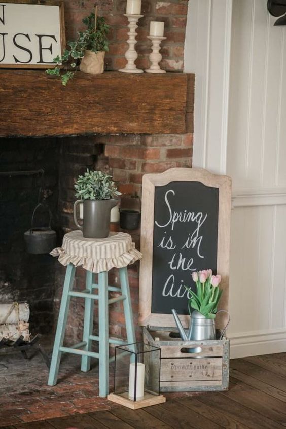 a simple chalkboard spring sign in a shabby chic wooden frame is a cool iea for a rustic space or a farmhouse one