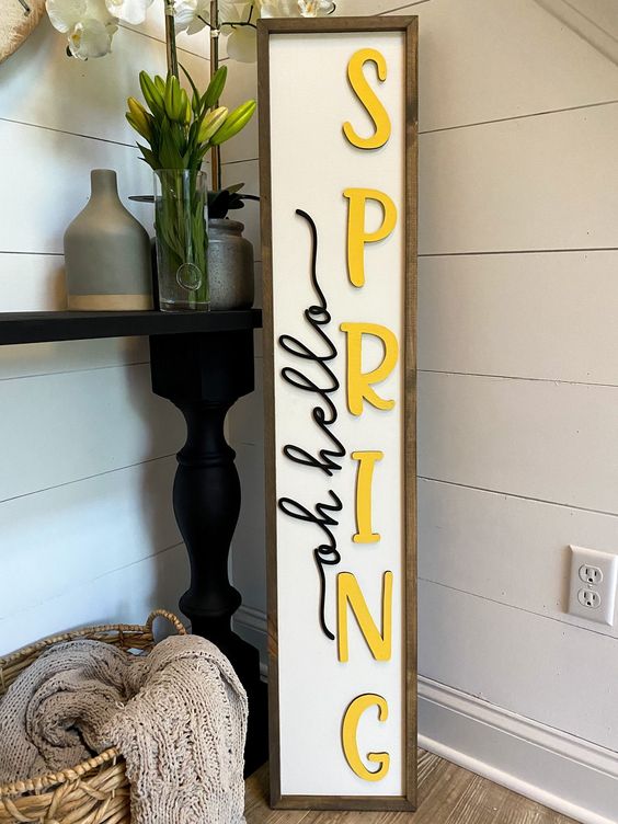 a simple spring sign is a cool idea for a rustic or farmhouse porch, and you can make one easily