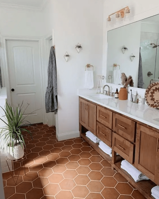 a cozy bathroom with large mirrors