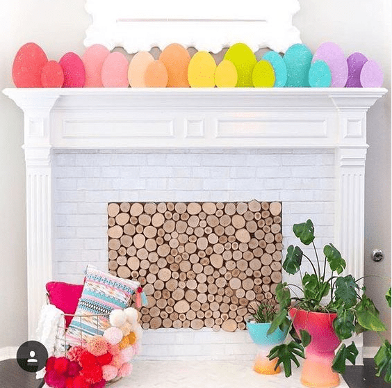 a very simple and cute Easter mantel done with rainbow-colored cardboard eggs to add color