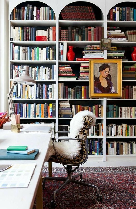 a series of built-in arched bookcases, a desk and a chair are a cool combo for a home office, make contrasting backing for the bookcases