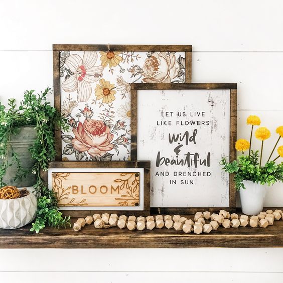 three spring signs with flowers, wood bunrt blooms and printed words are very easy to make to create a spring feel in the space