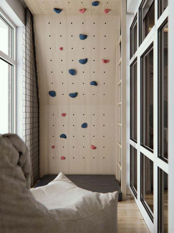 a balcony done with pegboards and turned into a climbing space is great for a modern kid’s space, your kids will be happy