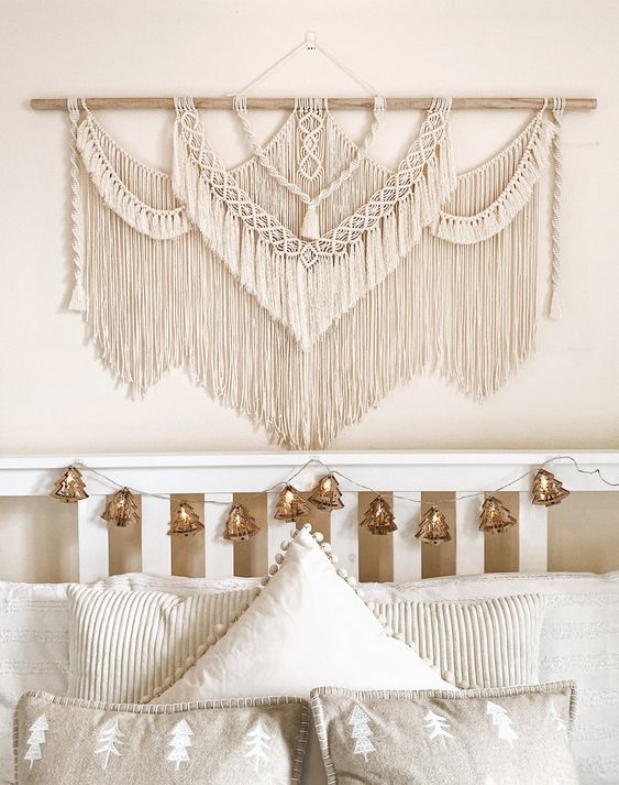 a beautiful and complicated neutral macrame over the headboard will give a boho feel to the bedroom