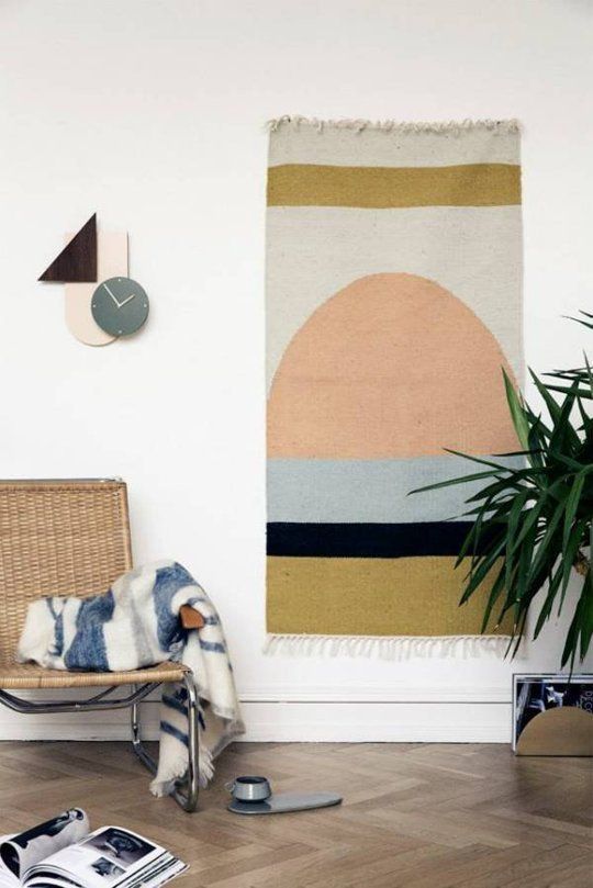 a bold boho rug on the wall is a very eye-catchy solution for a modern or boho space