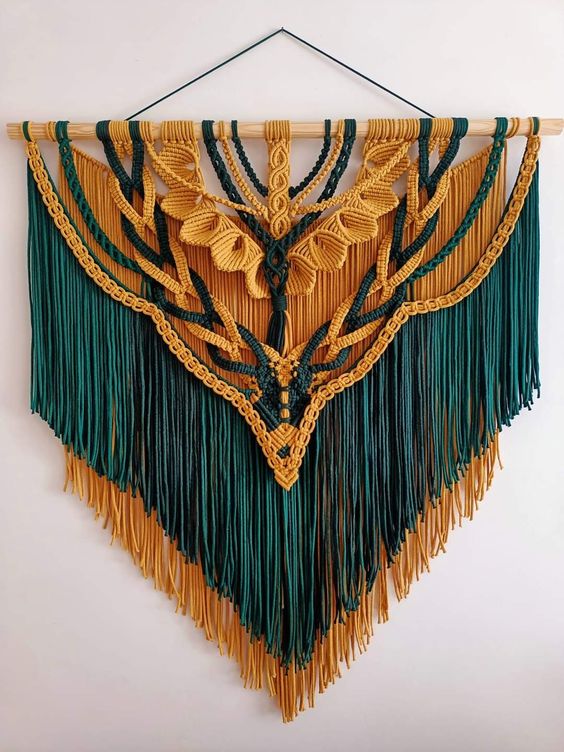 a colorful emerald and yellow macrame with fringe will make a bold color statement in the space