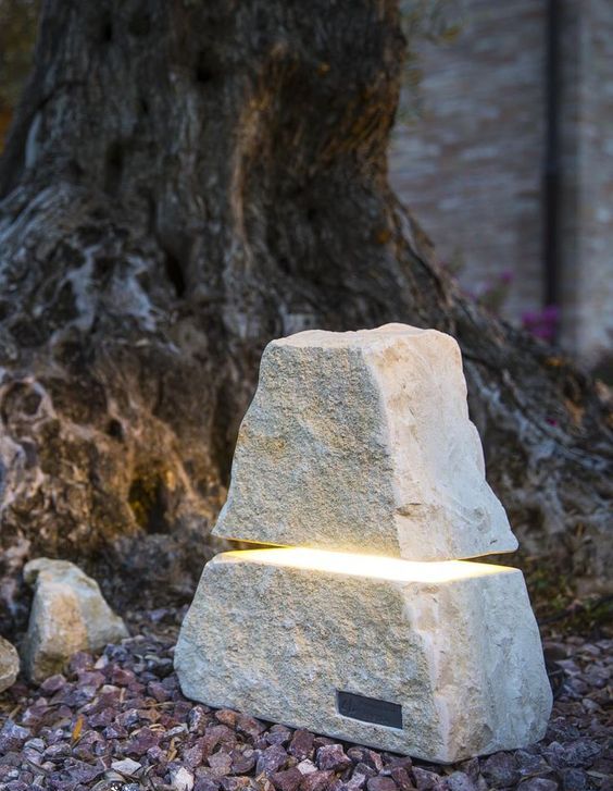 a gorgeous stone-like outdoor lamp is a unique solution for a modern or minimalist outdoor space