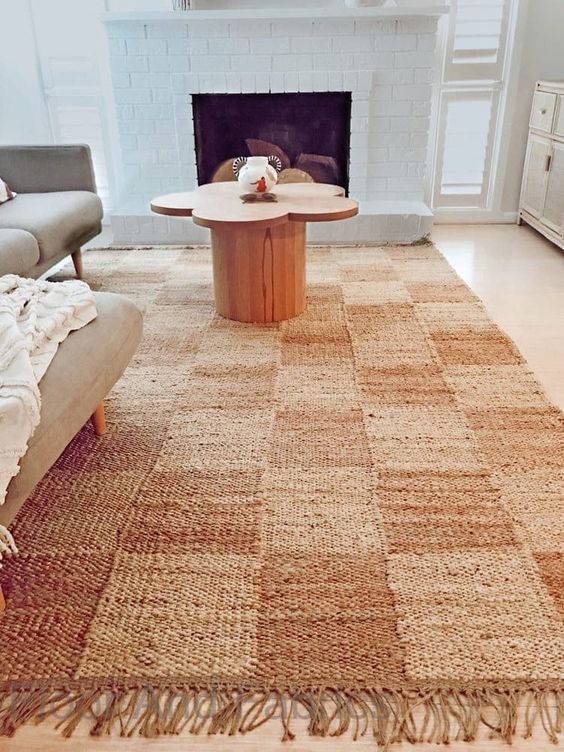 a large checked jute rug is a cool addition to many modern spaces, it will bring both texture and print