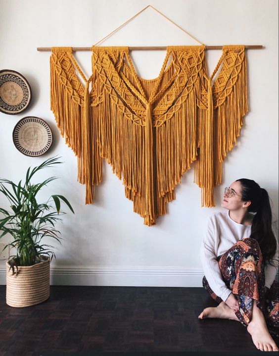 a large mustard macrame wall hanging is a fantastic idea for a boho space, it will add both texture and color
