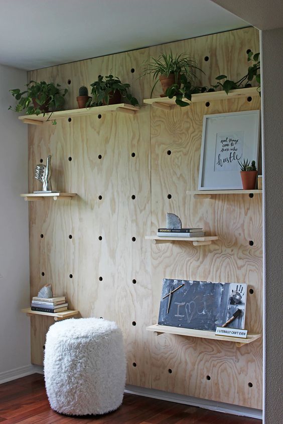 a large pegboard with shelves is a cool accent for any space, it will give you a lot of storage and display space