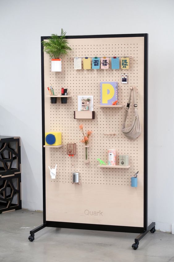 a mobile pegboard on casters, with hooks and shelves is a smart solution for many spaces, it will bring functionality