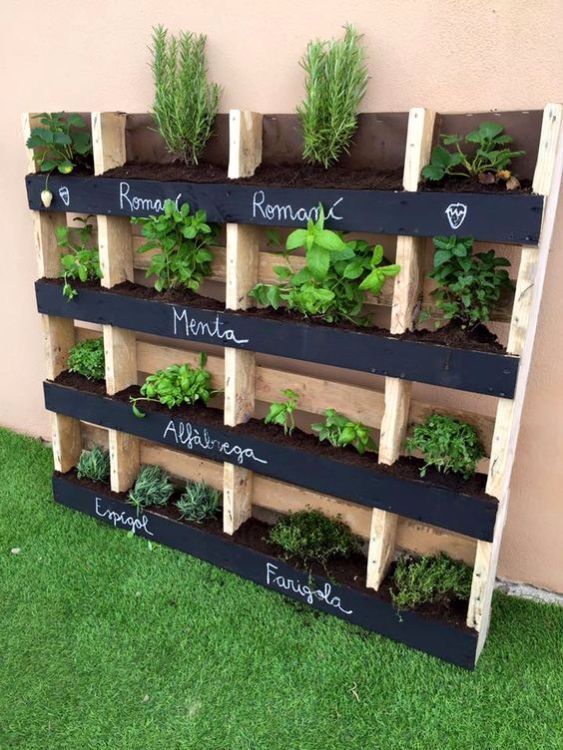 a pallet garden with some parts removed and chalkboard parts plus herbs planted is a cool idea if you want fresh herbs