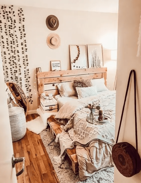 a rustic meets industrial bed built of pallet wood will easily fit a rustic or boho bedroom